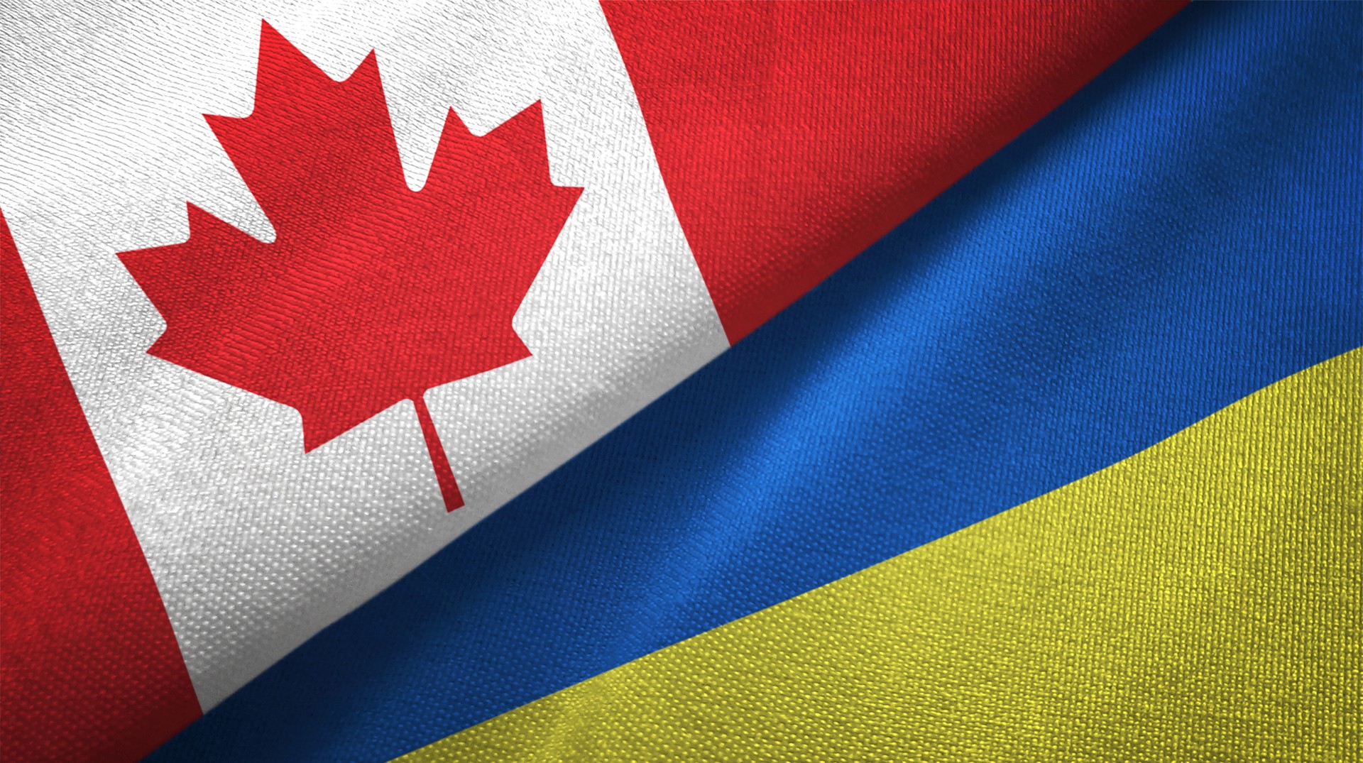 Ukraine and Canada two flags together realations textile cloth fabric texture